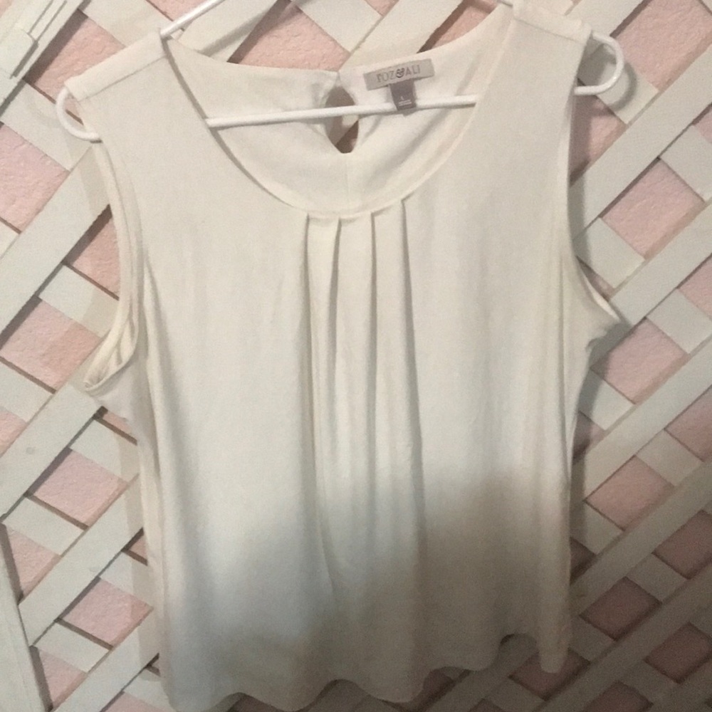 White sleeveless blouse